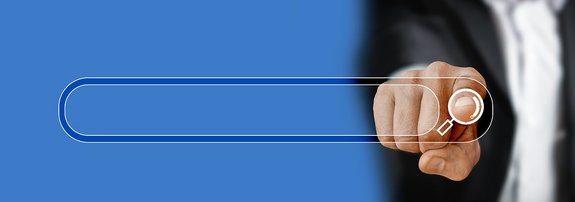 Ein Finger der auf eine digitale Suchleiste zeigt